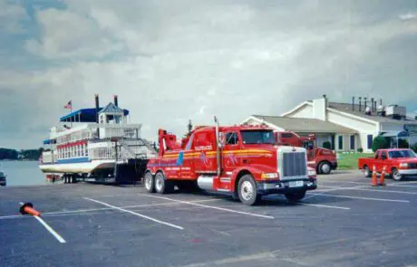 paddacks recovery truck hauling a marine vessel